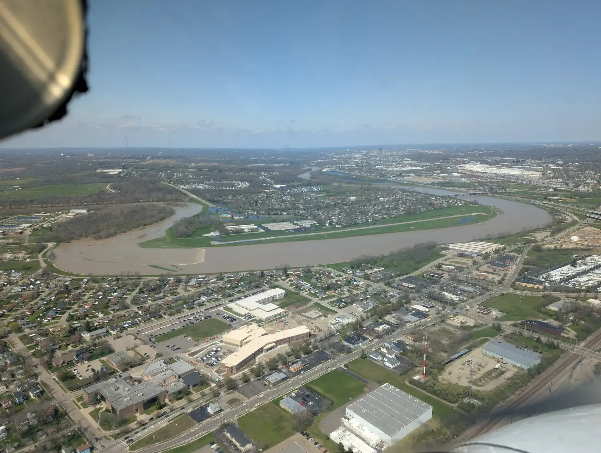 Aerial view of the river winding through Dayton, seen from a Dayton Aviation Services training flight