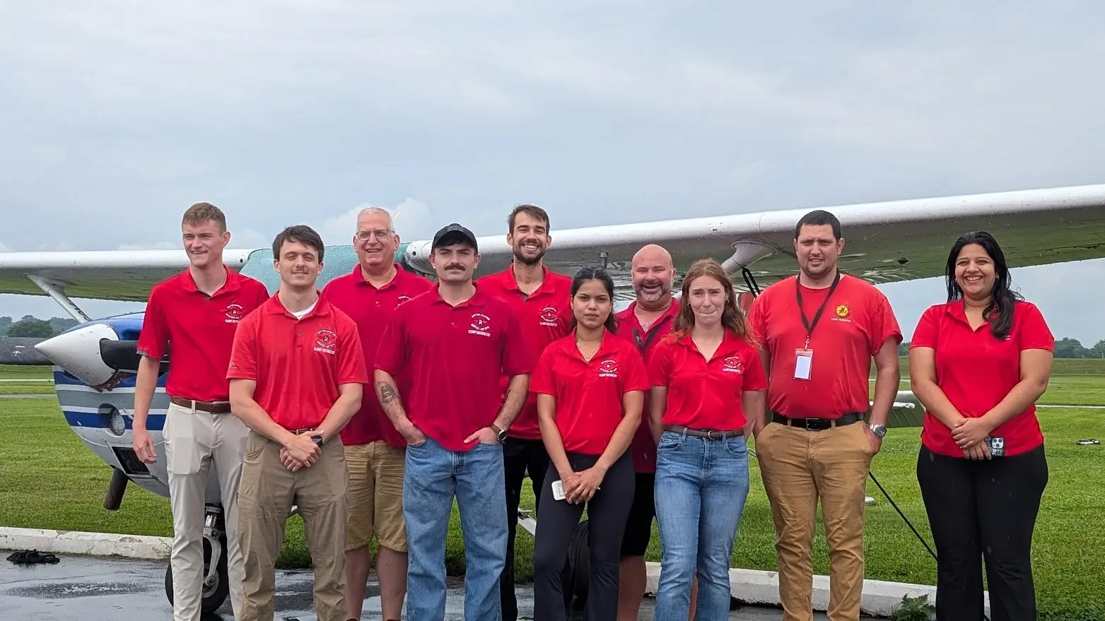 Dayton Aviation Services team in front of an airplane