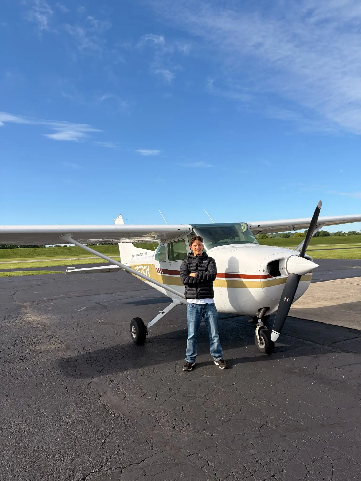 Professional pilot standing in front of a Cessna training airplane