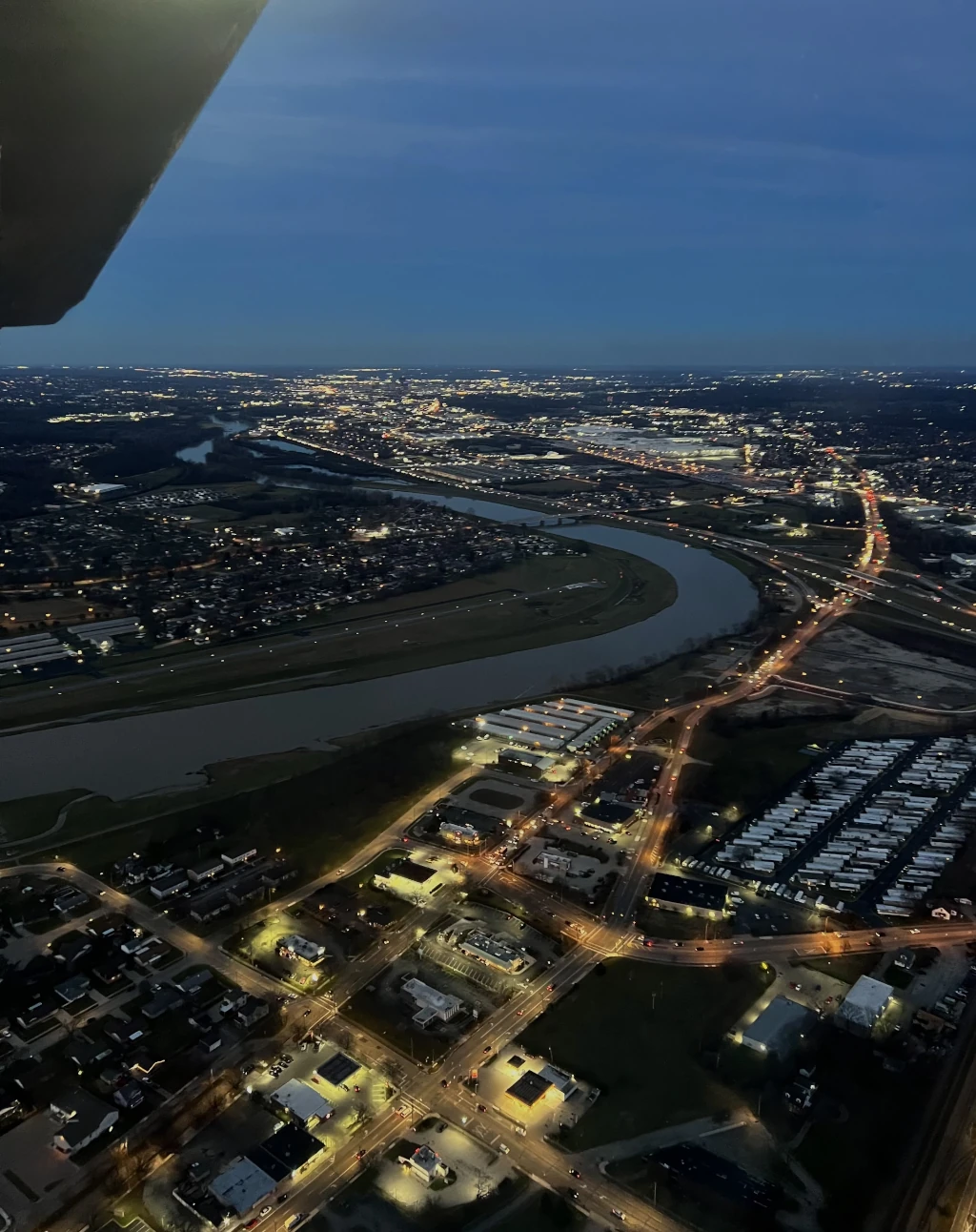 Night flight over city seen from cockpit window